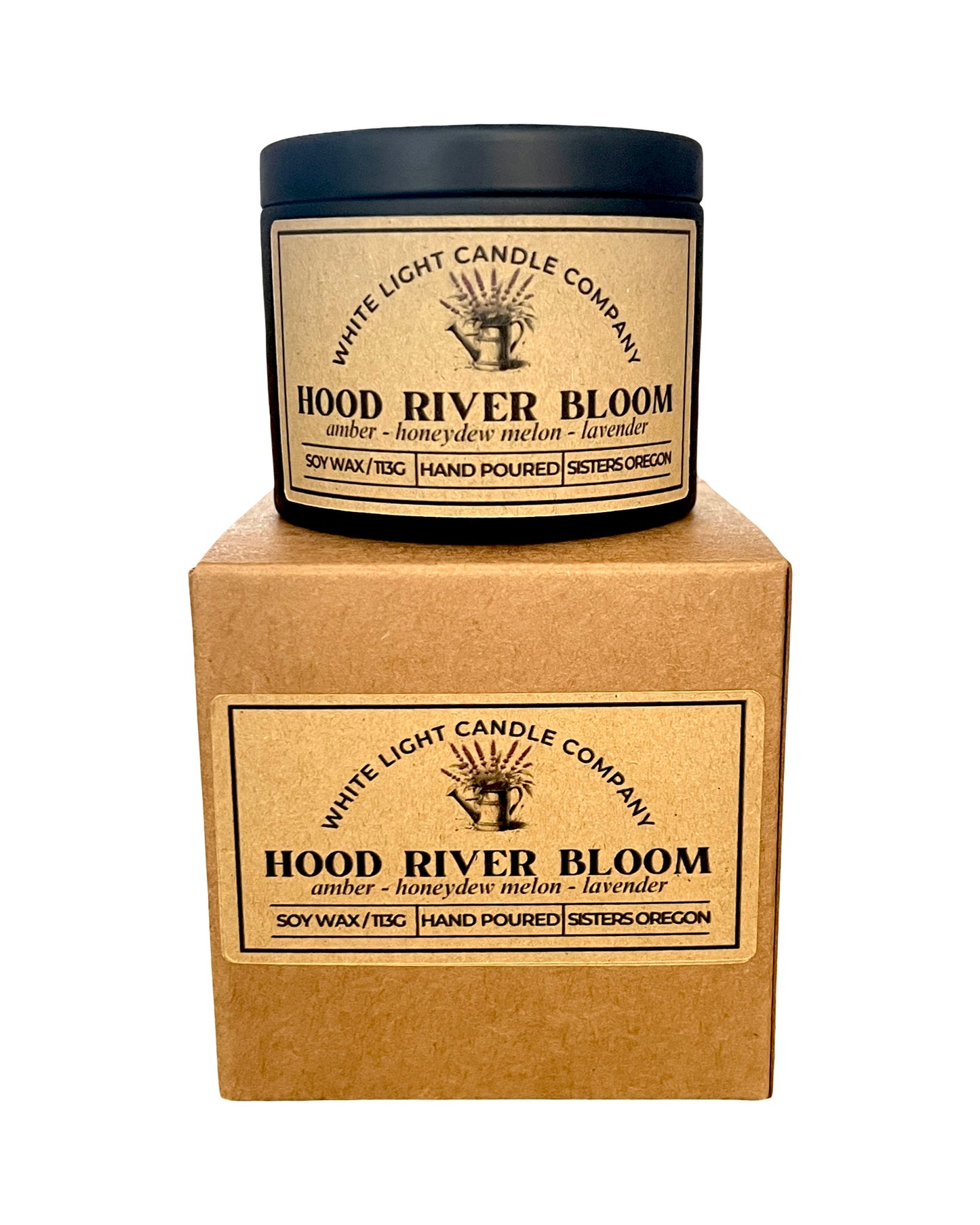 Candle with 'Hood River Bloom' label on a matching cardboard box, White Light Candle Company branding visible.