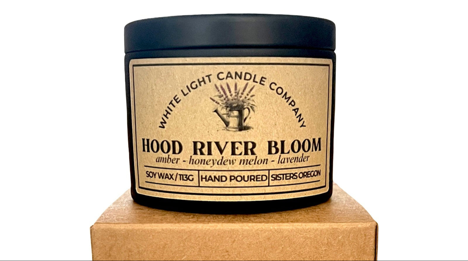 Candle jar with 'White Light Candle Company' label on a white background